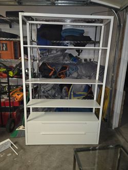 White shelving unit with two drawers