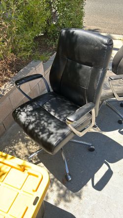 2 office chairs one works and other won’t rise -leathers good