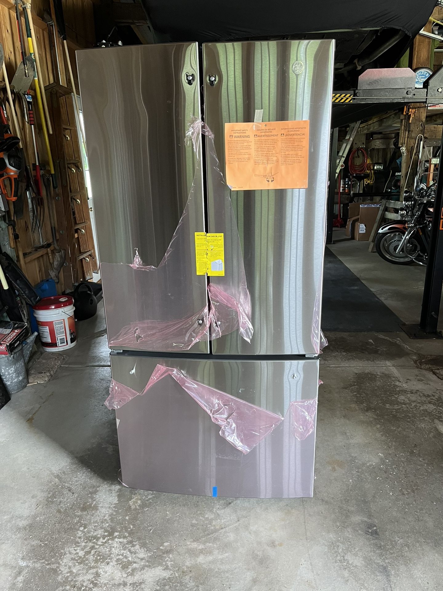 New 24.7 Cu Ft GE refrigerator