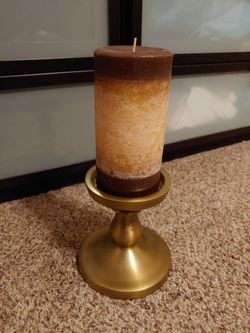 Bronze candle holder with candle