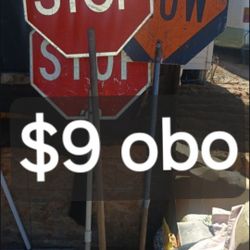 Three Traffic Control Construction Signs. STOP on one side SLOW on the other side.