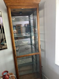 Howard Miller Oak Curio Cabinet