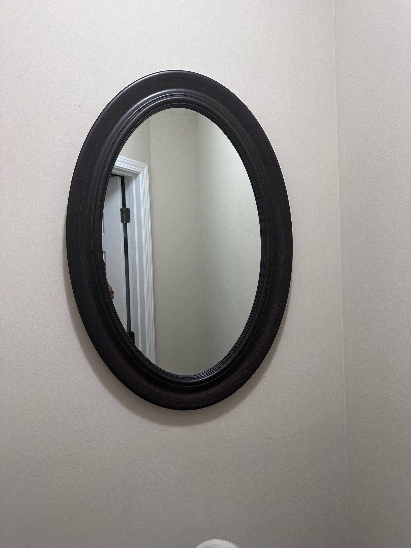 Oval wall mirror