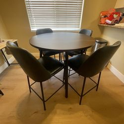 Dark wood dining room set with 4 chairs