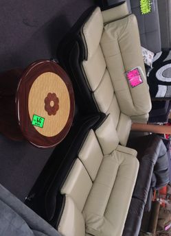 Brown and beige sofa and love seat