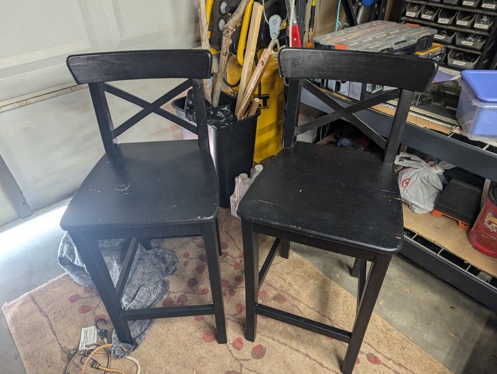Two solid wood bar stools, seat 24 and 1/2 back 25 and 1/2