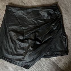 Black faux leather asymmetrical hemline skort