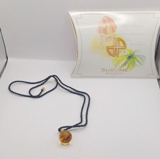 Jean Patou Sublime, a glass Murano Pendant and corded ribbon