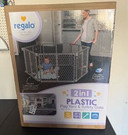 New baby gate sell or trade for Enfamil 12 oz cans