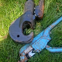 The tool shown in the image is a manual hydraulic crimper, specifically the Huskie Tools TEP-410 model. This tool is used to compress or press connect