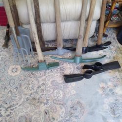 4 PICK AXES   1 MADAXE. 2 MADAXE HEADS  2 CAULTIVATERS. 1 SQ SHOVEL 2 SMALL MADAXES.  