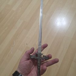 Dragon statue with removable sword