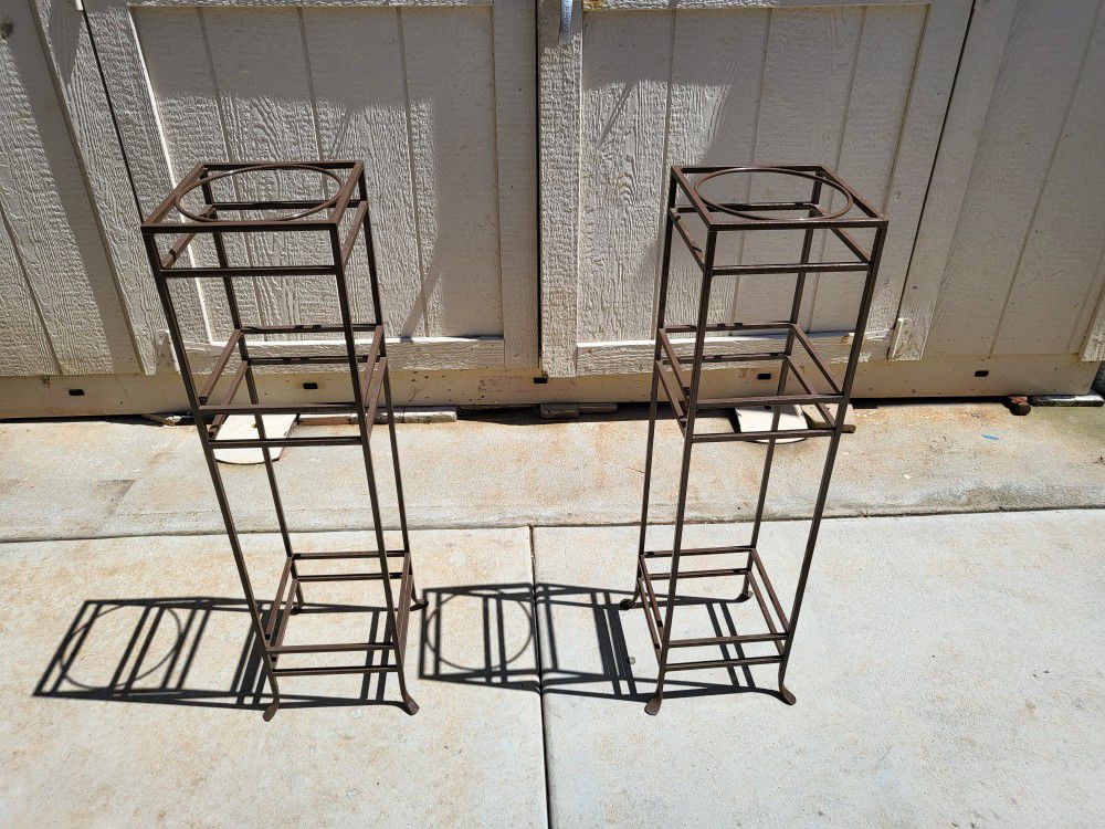 2 metal powder coated brown plant holders.  $30 Dollars for both 