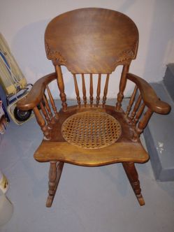 Antique oak, caned seat rocking chair