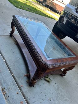Carved Wood Glass Top Coffee Table