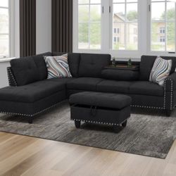 Black sectional couch with ottoman, cup holder 