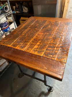 Rustic barn wood table with pipe legs