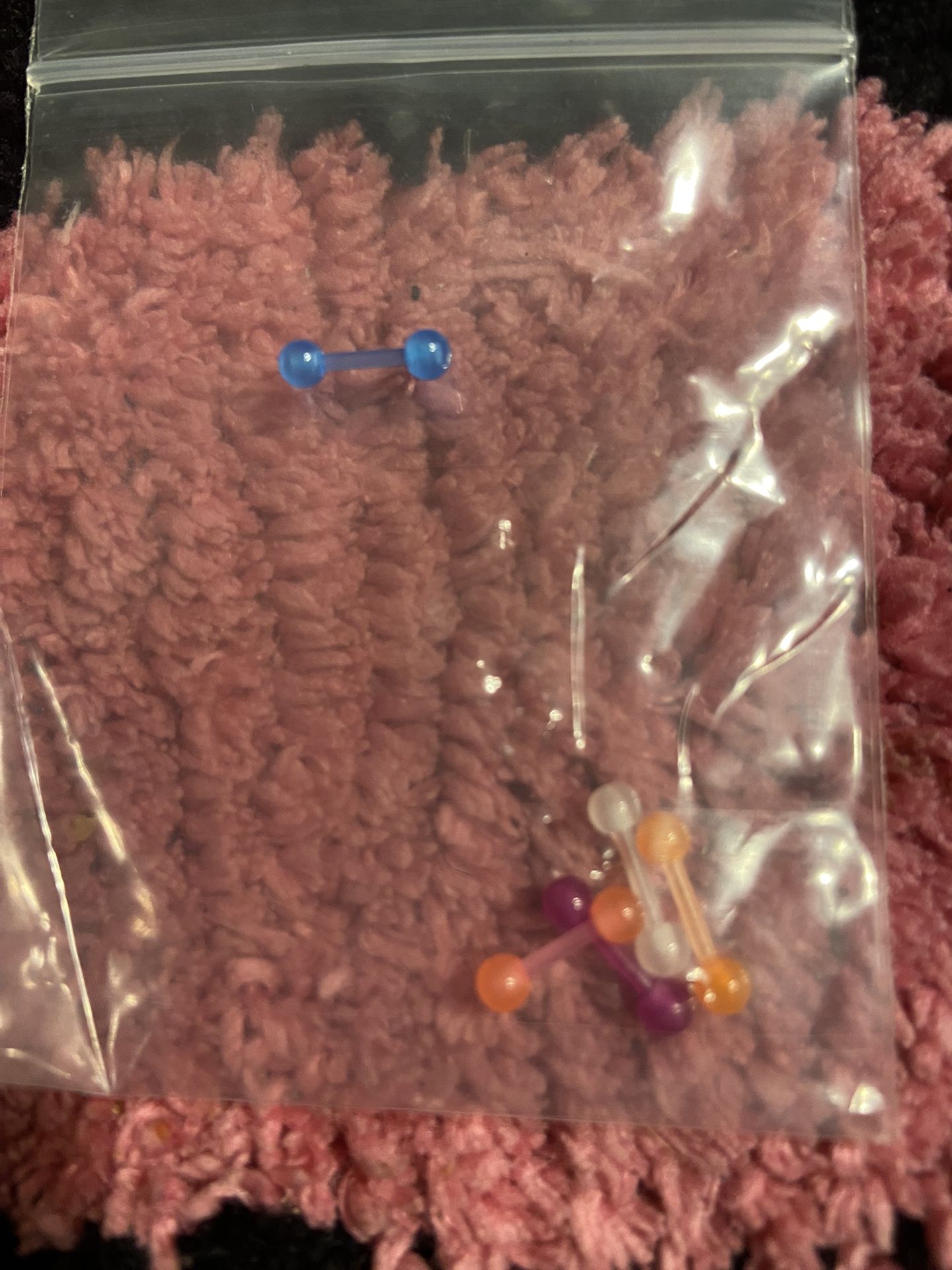 These are brand new Colorful Barbell Piercing Set These are a size small.