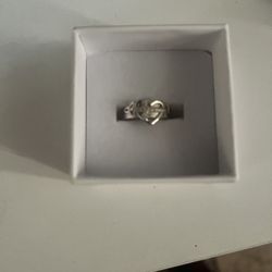 cross through heart ring