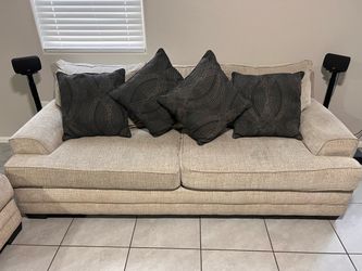 Beige fabric sofa and loveseat set