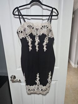 Short black dress with lace embroidery