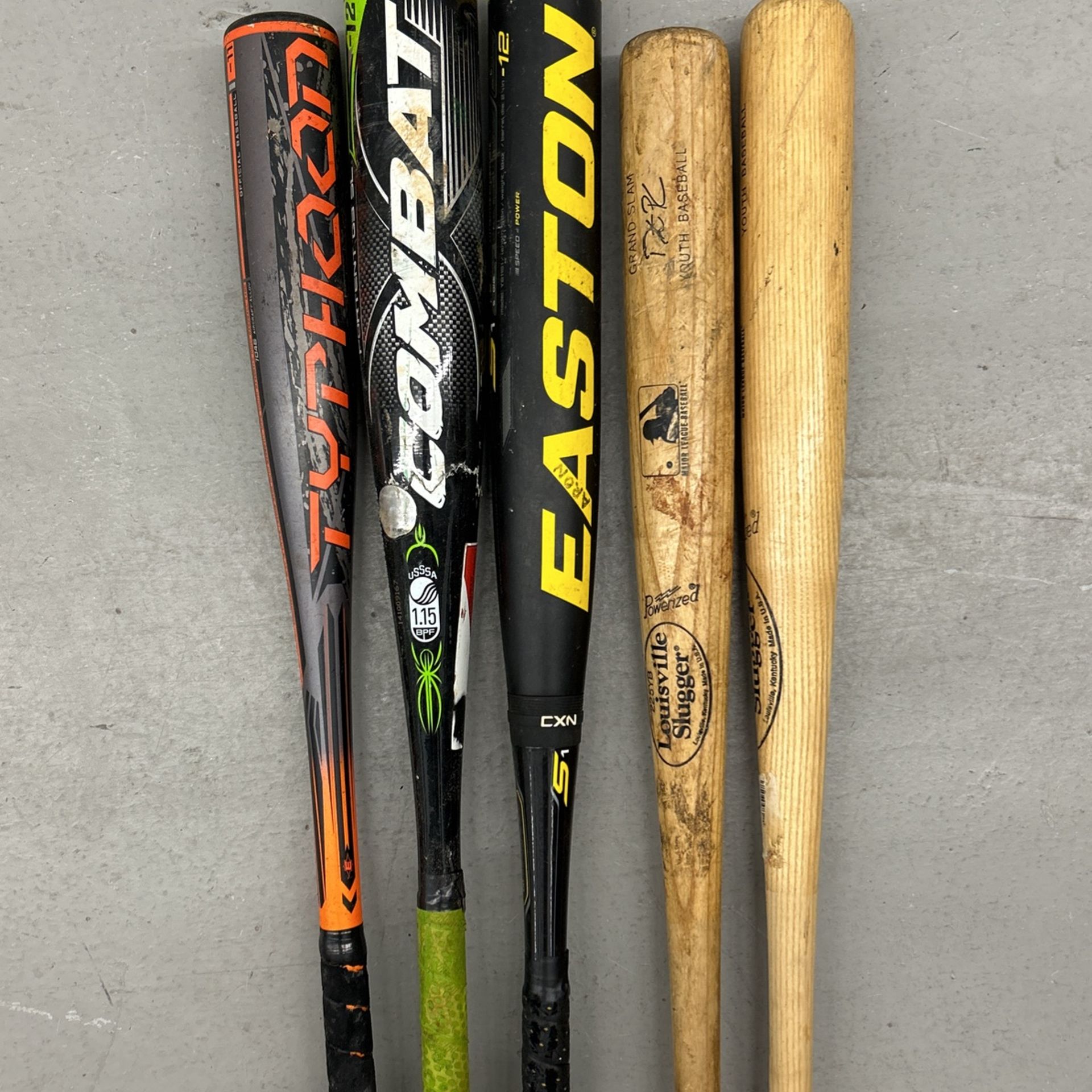2 Wood Bats, 2 -12 Baseball Bats, And 1 -11 Baseball Bat