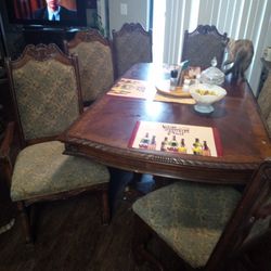 Ashley Dinning Room Table And Chairs, Heavy To Pick Up 4,R Chairs And Two Captains Chairs I'm Selling It It's Just Too Big For My Apartment 