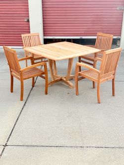Grad A teak patio table and 4 chairs Brand New