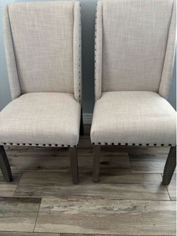 2 tan chairs