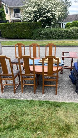 6 chairs and oak table 4’ round with 2 extensions