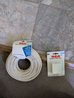 RCA 100 FT CAT 3 STATION WIRE FOR PHONES, AND COMES WITH MODULAR WALL JACK AS SHOWN IN PICTURES