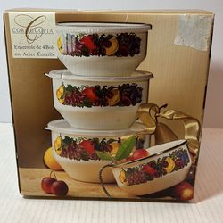 This item is a vintage Tabletops Unlimited "Kensington Garden" 4-piece nesting bowl set featuring a vibrant fruit design