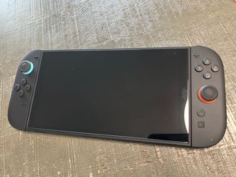 Like New Nintendo switch 2 console with Joy Con 2 Controllers, charger and screen protector in like new condition.