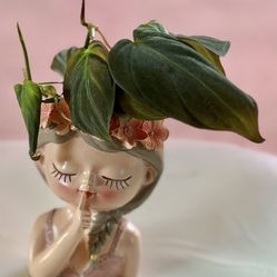 Shushing Girl With Philodendron 