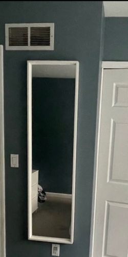 White wall of floor mirror
