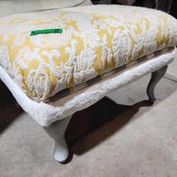 Vintage ottoman in yellow and white 
26"w x 19"d x 17"h
Silver painted wood feet