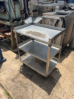 Stainless Service Cart 18”x27”x34” doesn’t roll well)