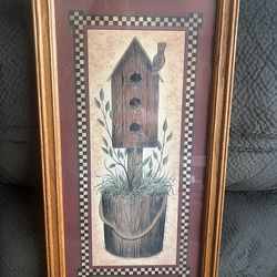 Rustic homestead scene featuring a quaint birdhouse nestled  picture frame