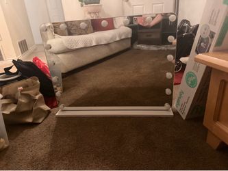 Vanity mirror with plugs on side