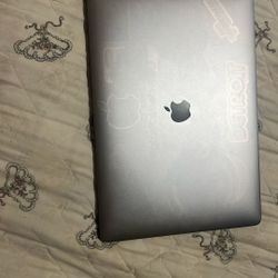 Macbook 15 Inch w/ touchbar (Includes a charger)