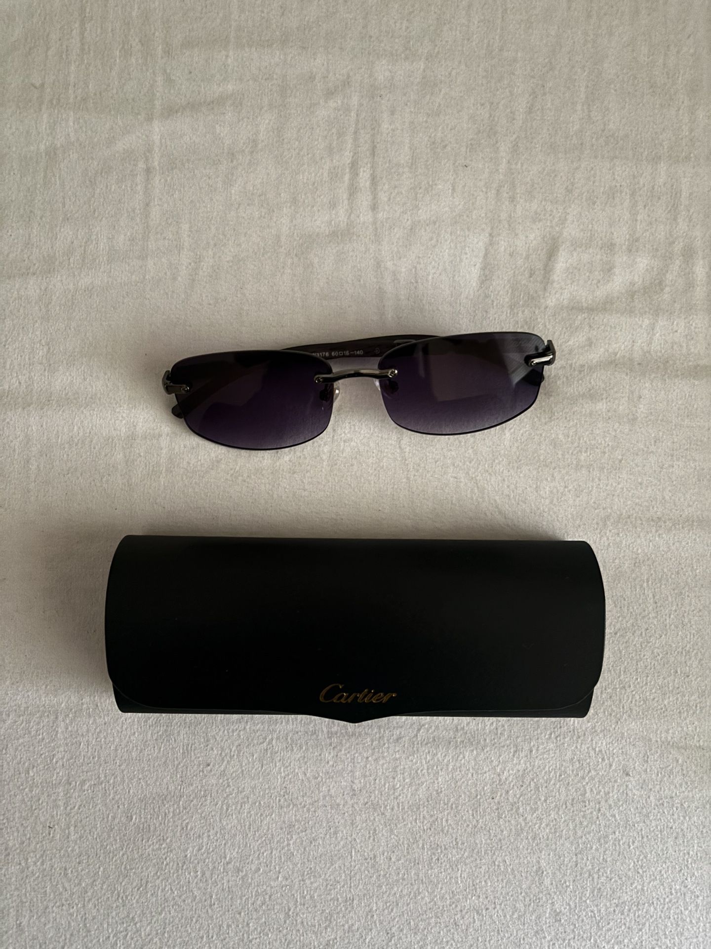 Black Cartier sunglasses with case