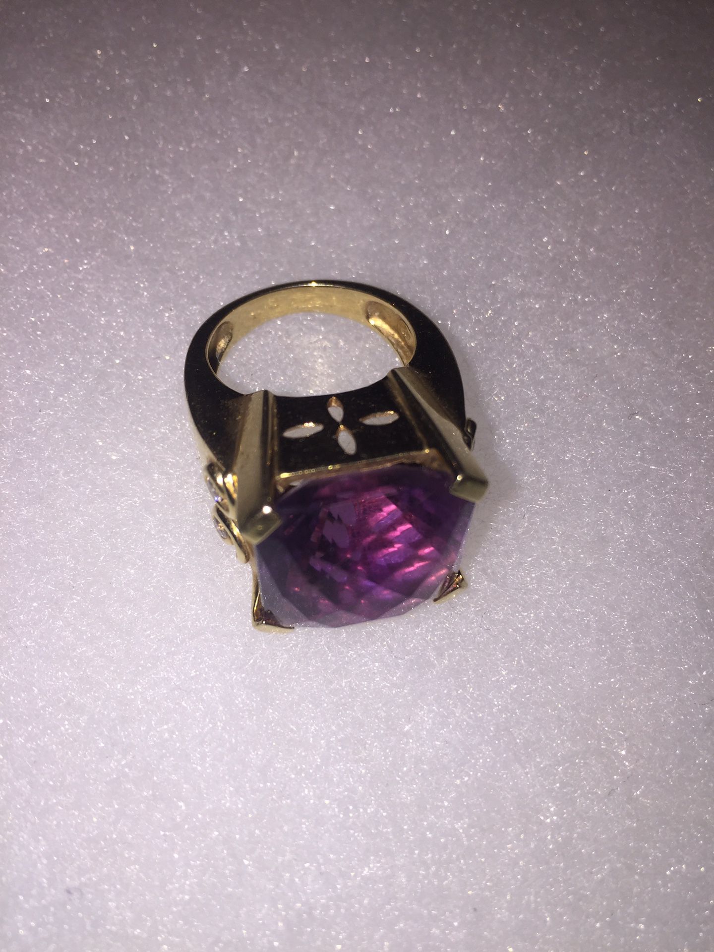 14 karat gold ring with four diamonds and purple amethyst gemstone