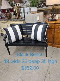 Black Wood Bench with Striped Pillows We are located at 2811 East Bell road. Another Time Around Furniture.