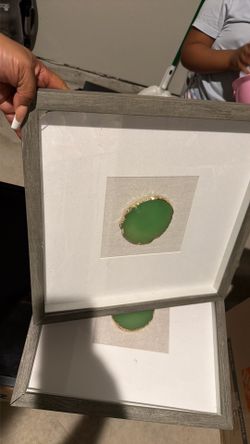 2 grey wooden pictures