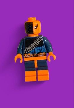 LEGO Deathstroke DC Minifigure. LEGO DC Comics Deathstroke the Terminator minifigure with blue and orange suit with black and white diagonal stripes o