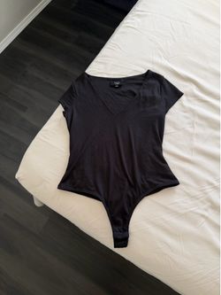 Women’s black body suit