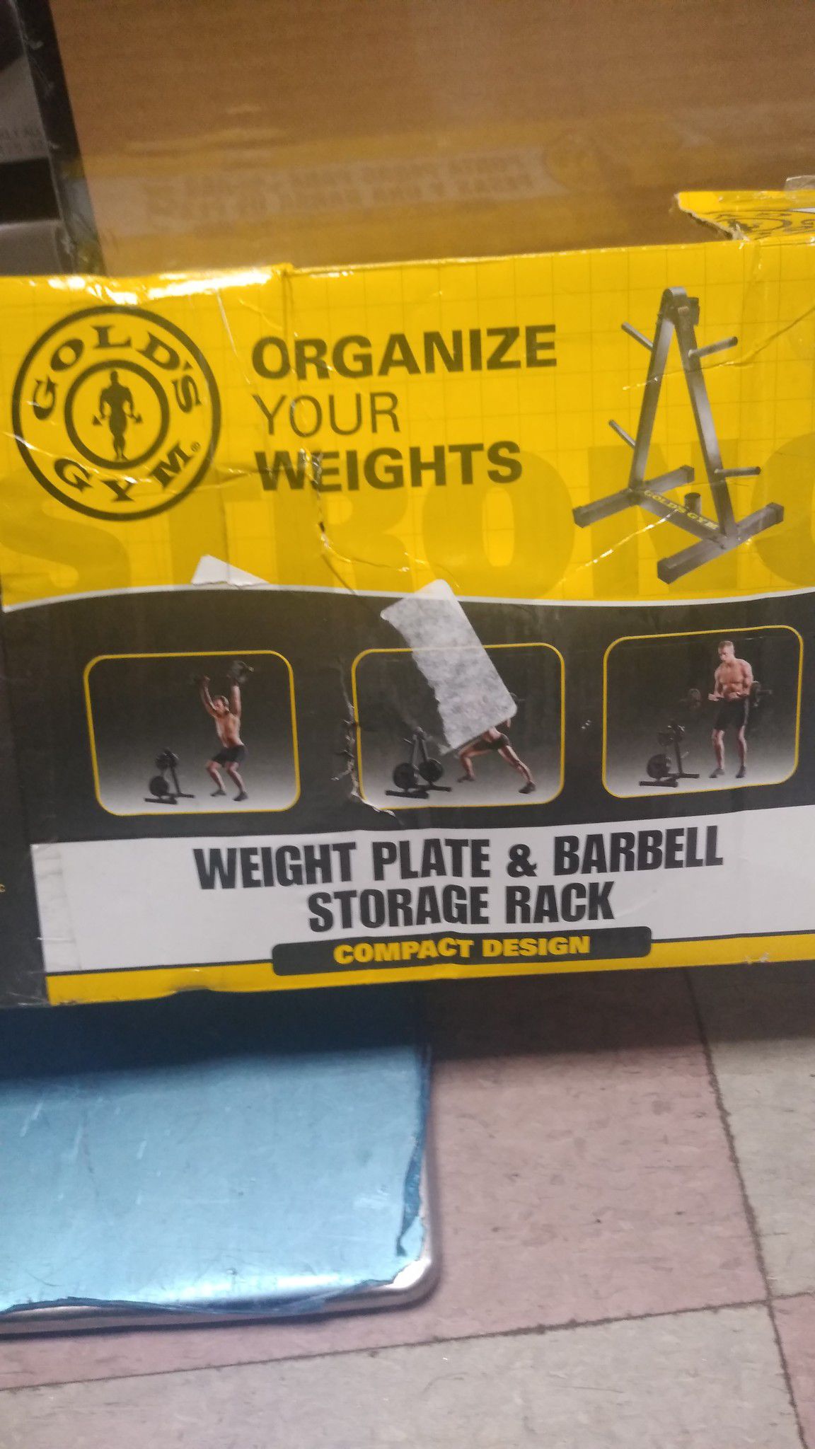 Gold's Gym weight plate and barbell storage rack compact design