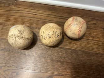 Three vintage baseball balls
