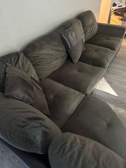 Large Gray Tufted Sofa with Pillows