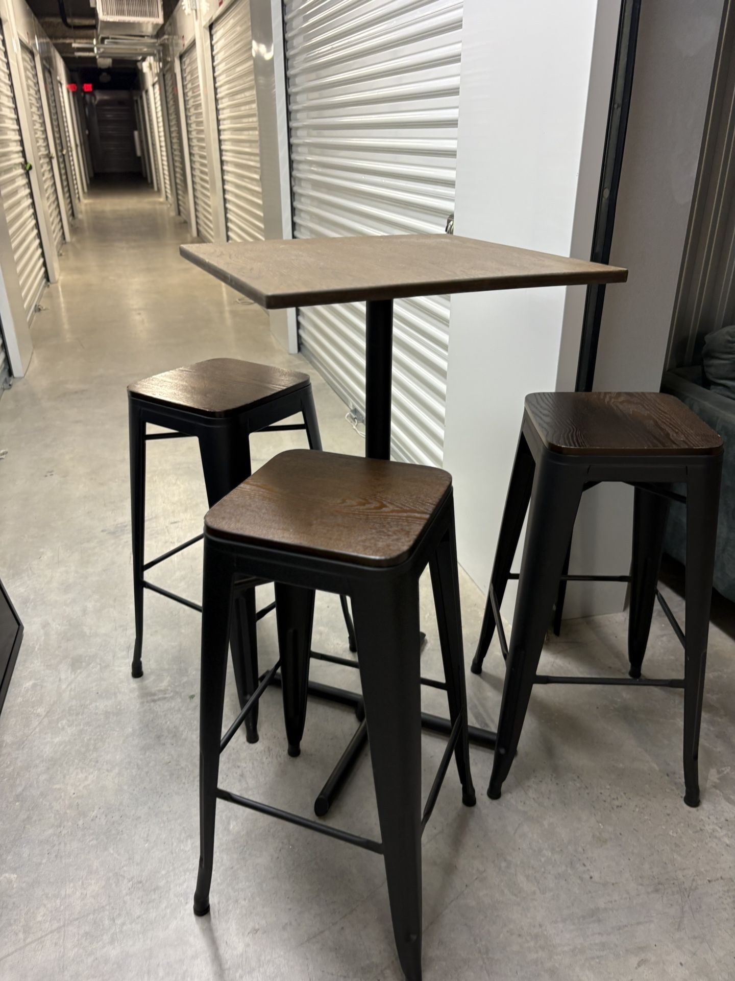Dining area tables and chairs. Restaurant use. High top table 3 Chairs (4 Sets) Each set table and 3 chairs 520 each set Discount if you buy more